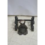 A 19th CENTURY CAST IRON DOOR STOP,