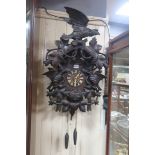 A VERY FINE AND IMPRESSIVE BLACK FOREST CUCKOO CLOCK, carved with birds,