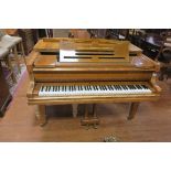 A VERY FINE NIENDORF SATINWOOD CASED BABY GRAND PIANO,