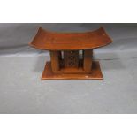 AN ASHANTI HARDWOOD STOOL,