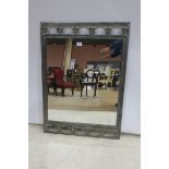 A RETRO WHITE METAL FRAMED MIRROR,