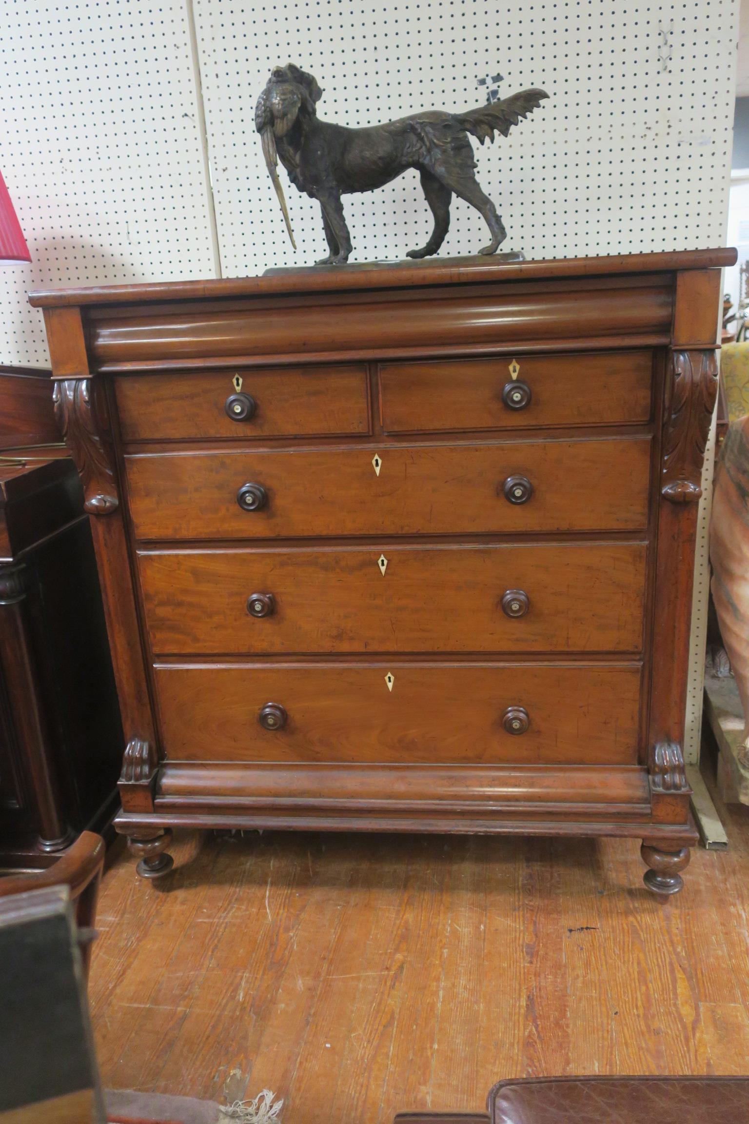 A VICTORIAN MAHOGANY CHEST of rectangular outline the shaped top above one long two short and three