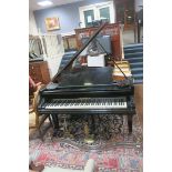 A BECHSTEIN EBONISED CASE GRAND PIANO on square tapering legs with brass castors 97cm (h) x 147cm