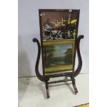 A 19TH CENTURY MAHOGANY CHEVAL MIRROR the rectangular plate with a moulded frame flanked by scroll