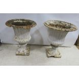 A PAIR OF 19th CENTURY CAST IRON URNS,