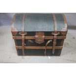 A CANVAS UPHOLSTERED COPPER BOUND DOME TOP TRAVELLING TRUNK,