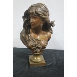 A BRONZE THREE QUARTER LENGTH BUST of a female with flowing hair and linen drapery 45cm (h)