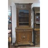 A FINE PAIR OF 19TH CENTURY CARVED OAK BOOKCASES each of inverted breakfront outline the frieze