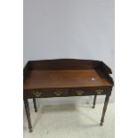 A 19TH CENTURY MAHOGANY SIDE TABLE of rectangular outline with moulded three quarter gallery above