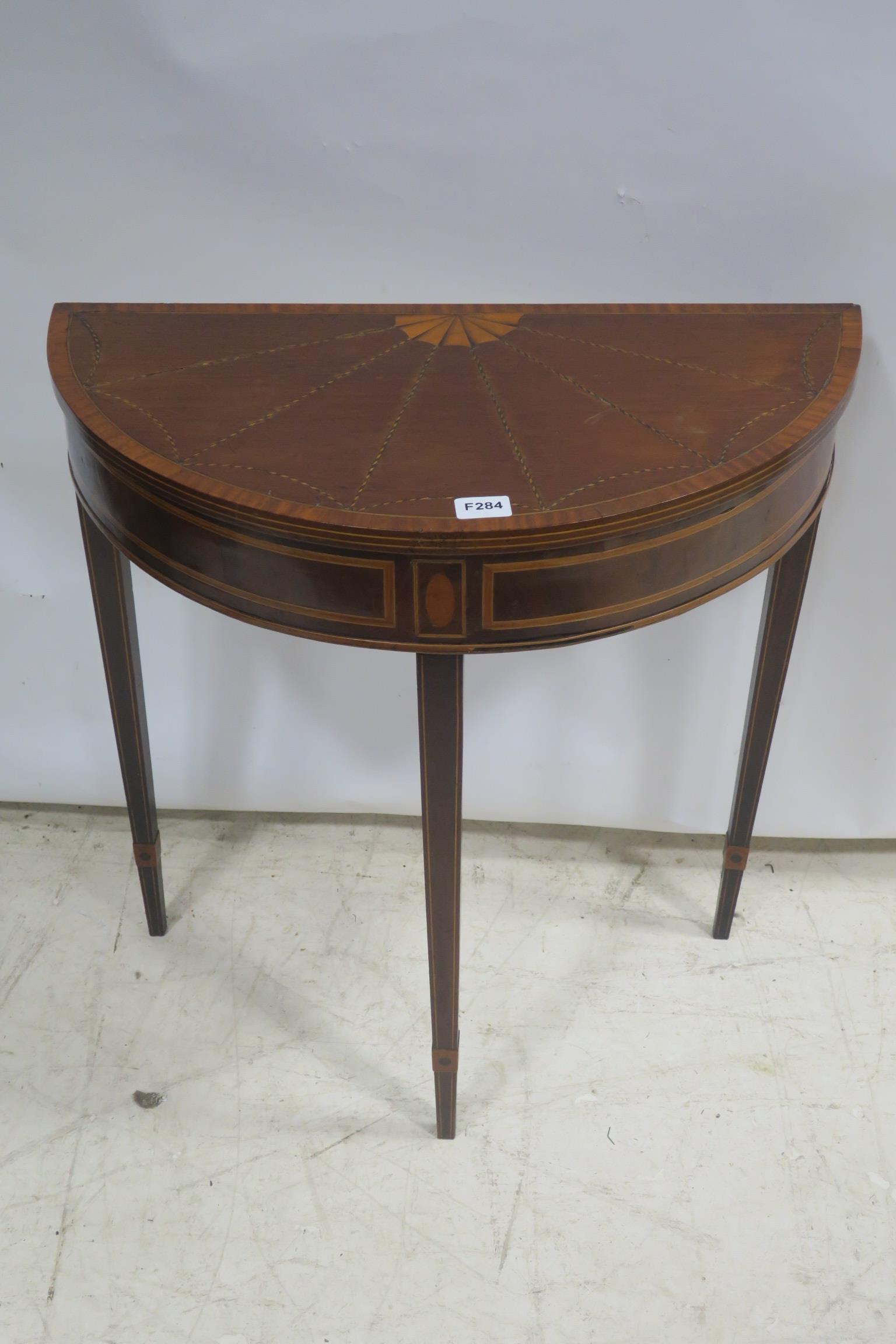 A FINE 19TH CENTURY MAHOGANY AND SATINWOOD CROSS BANDED SIDE TABLE of demi lune outline the shape