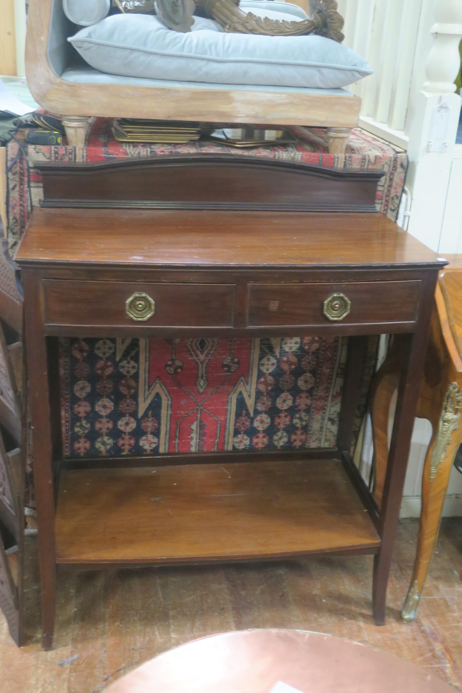 A 19TH CENTURY MAHOGANY SIDE TABLE of Demi Lune outline the shaped top with carved and moulded back