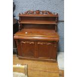 A 19TH CENTURY MAHOGANY SIDE CABINET the super structure with open shelves joined by scroll