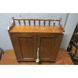 A 19TH CENTURY MAHOGANY HANGING WALL CABINET with baluster gallery above a pair of cupboards on