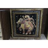 A PAIR OF INDIAN TAPESTRIES depicting figures sitting on an elephant and a horse in gilt frames