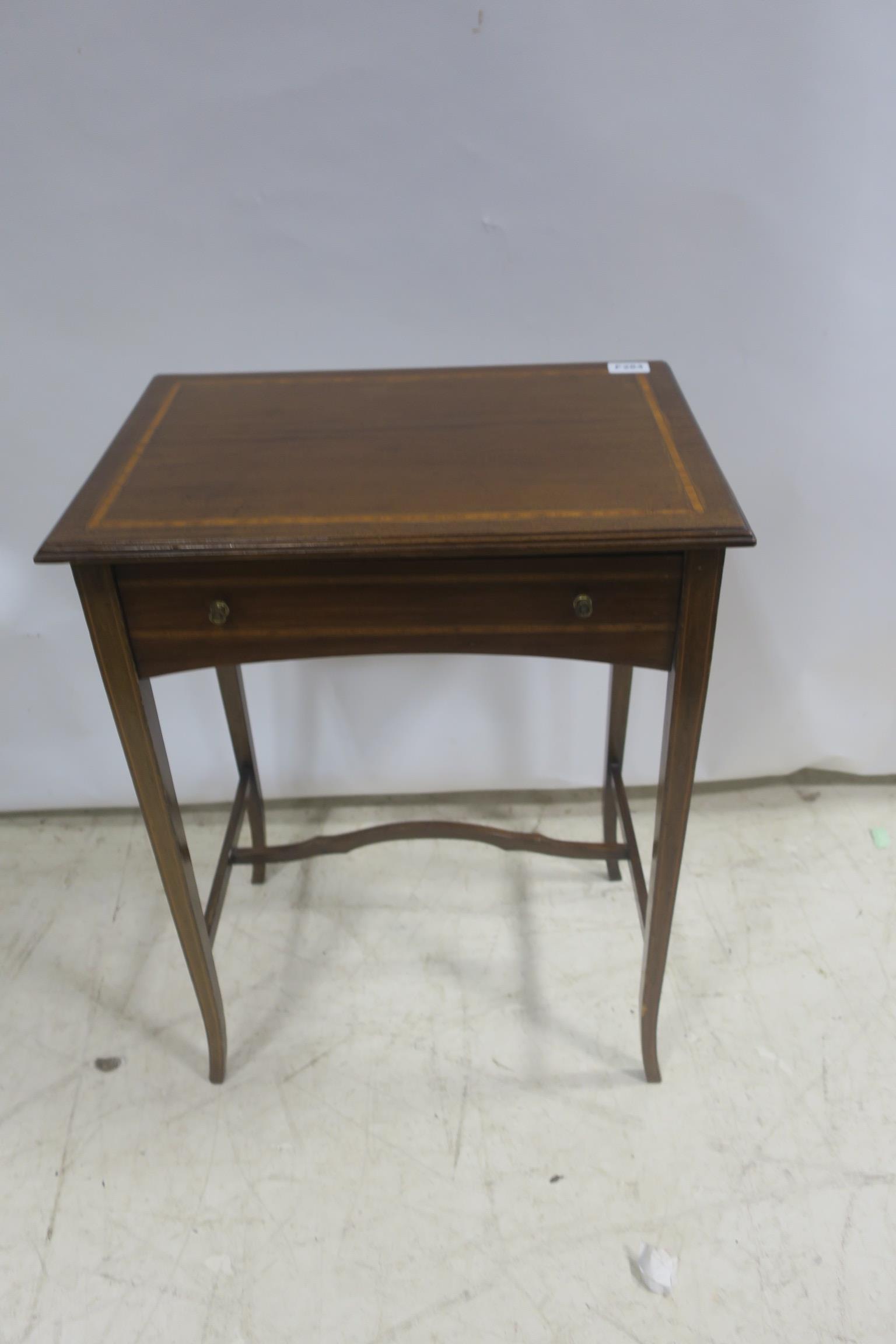 A 19TH CENTURY MAHOGANY AND SATINWOOD INLAID OCCASIONAL TABLE of rectangular outline shaped top