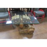A CARVED WOOD COFFEE TABLE CAR in the form of an engine with glazed top 51cm (h) x 70cm (w) x 60cm