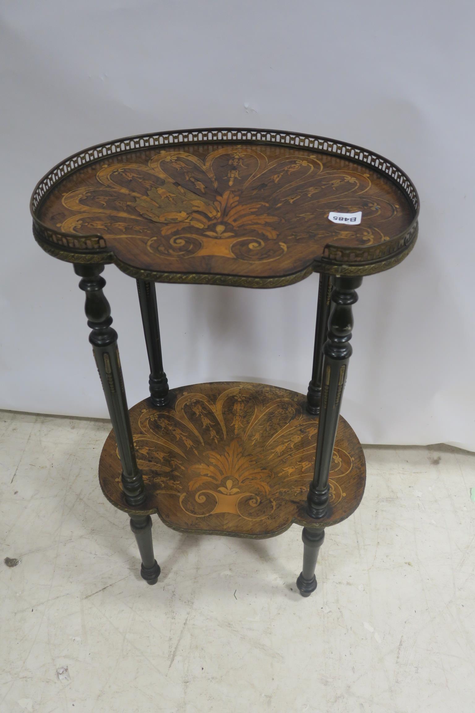 A 19TH CENTURY ROSEWOOD AND SATINWOOD OCCASIONAL TABLE with pierced brass gallery raised on reeded