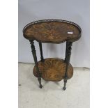 A 19TH CENTURY ROSEWOOD AND SATINWOOD OCCASIONAL TABLE with pierced brass gallery raised on reeded