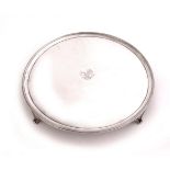 A George III silver circular tray the moulded and reeded rim enclosing a plain reserve engraved