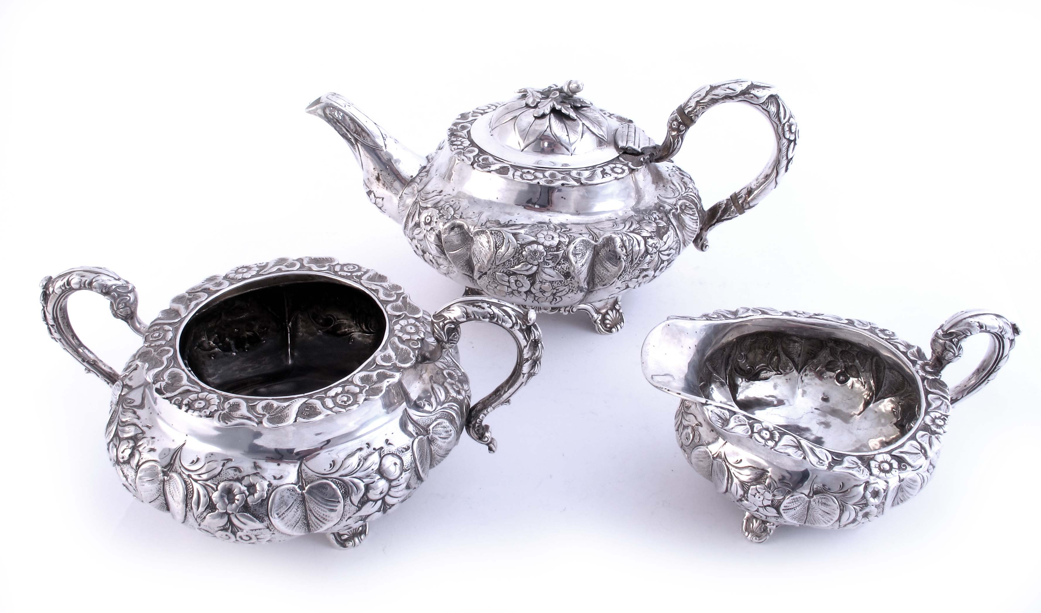 A William IV silver three-piece tea service, the squat, lobed,