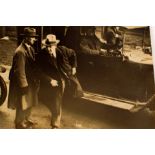 1921 Michael Collins, 'In haste'. A 6½" x 8½" photograph of Collins running from a motor car.