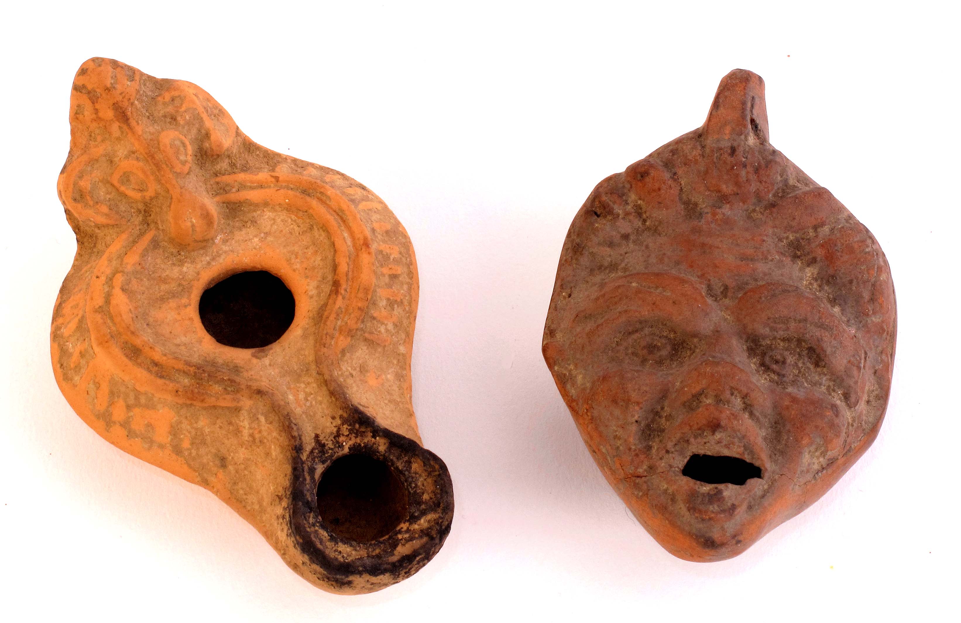 2ndC AD Two Roman terracotta lamps.