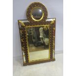 A CONTINENTAL MAHOGANY AND PARCEL GILT MIRROR the rectangular plate within a moulded frame with