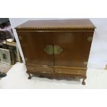 A CHIPPENDALE DESIGN MAHOGANY LINEN CUPBOARD of rectangular outline with gadrooned rim and