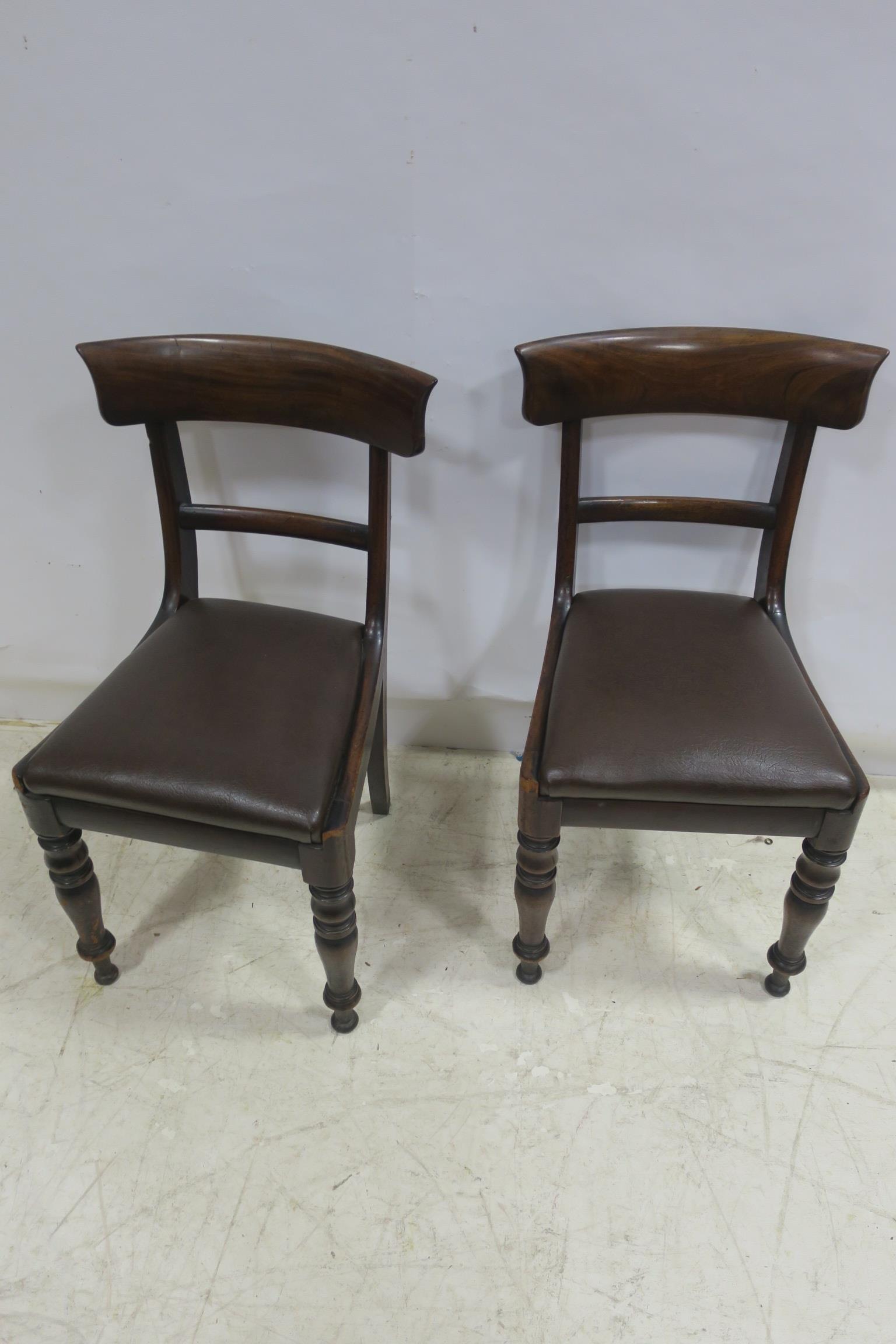 A SET OF TWELVE 19TH CENTURY DINING CHAIRS each with a carved top rail and splat above an