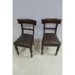 A SET OF TWELVE 19TH CENTURY DINING CHAIRS each with a carved top rail and splat above an