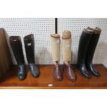 TWO PAIRS OF LEATHER RIDING BOOTS together with a pair of leather and canvas riding boots and a