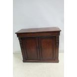 A FINE WILLIAM IV MAHOGANY SIDE CABINET of rectangular outline the shaped top above a pair of