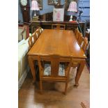 A NINE PIECE ORIENTAL HARDWOOD DINING SUITE comprising eight chairs including two elbow chairs each