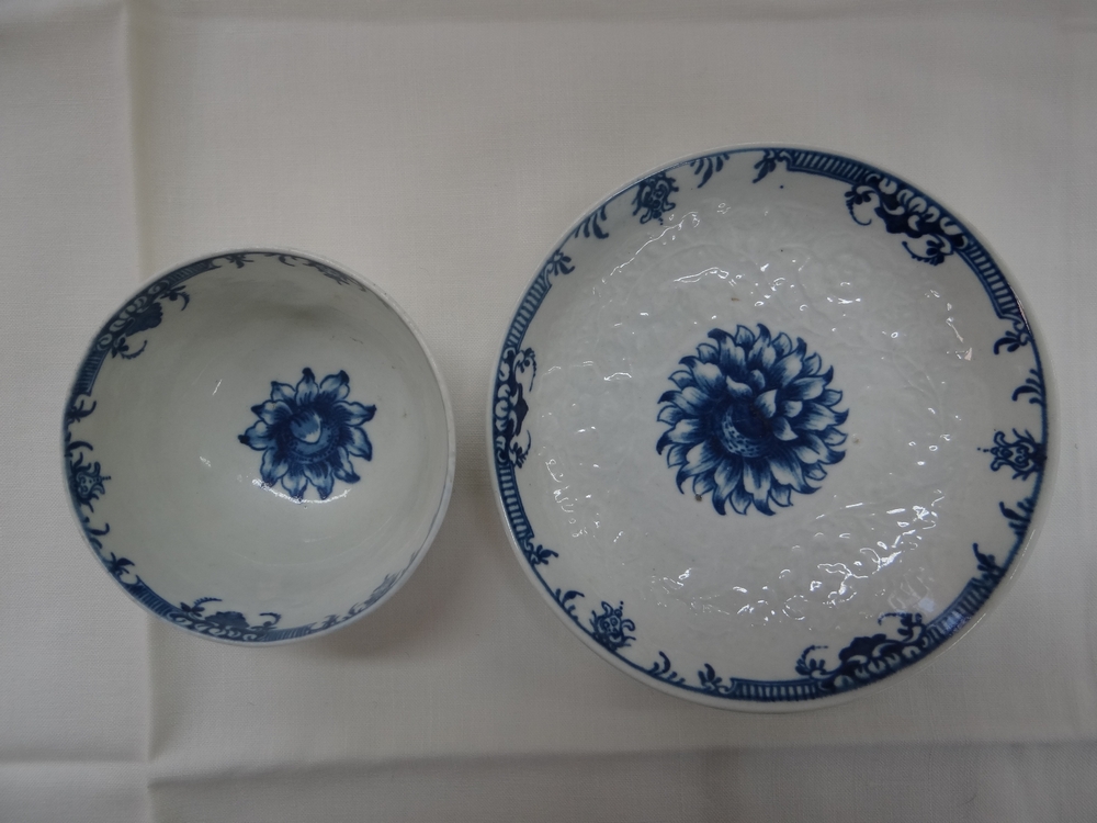 Worcester c 1765, first or Dr. Wall period. Sunflower pattern moulded tea bowl and saucer