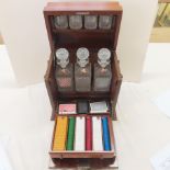 Decanter box containing three decanters, four glasses, gaming chips, dice, cards and a shaker