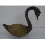 Cast bronze, or similar metal, very heavy swan with articulated wings which open to reveal a