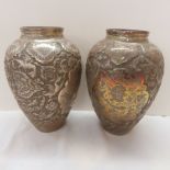 Good pair of 19thC heavily chased Eastern silver urns with decoration of birds of paradise, flora