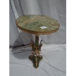 Onyx and gilt metal circular topped pedestal in the French style with three ram's head supports on