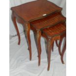 French kingwood parquetry and ormolu mounted nest of three tables on square, tapering cabriole legs