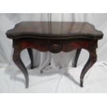 19thC French red boule serpentine side folding card table with decoration of sabots to sides and