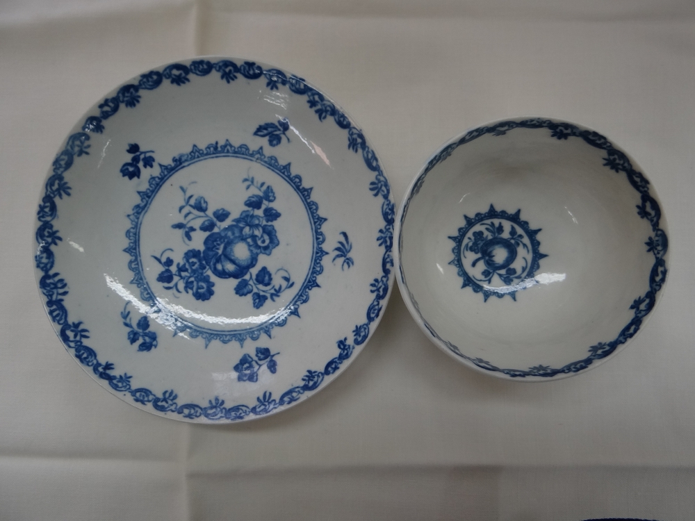 Caughley c 1780. Fruit pattern tea bowl and saucer in underglaze blue with various fruits. S+