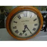 19/ 20thC oak cased station clock with painted 19 inch dial to each side, chain driven double