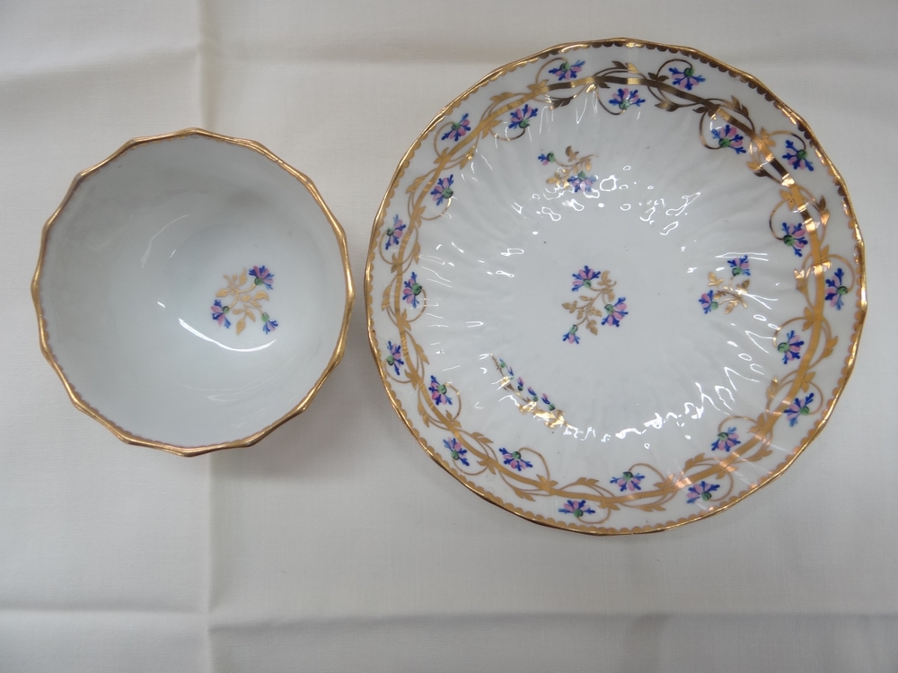 Derby c 1790. Pattern No. 111 tea bowl and saucer with gilding and gold, blue, pink and green