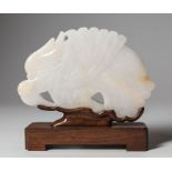 Chinese White Jade Chime or Plaque , carved as a dragon in flight, top pierced for hanging, h. 4 1/4