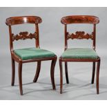 Suite of Four American Late Classical Carved Mahogany Side Chairs , mid-19th c., scrolled crest