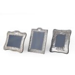 Three English Sterling Silver Picture Frames , Carr's of Sheffield, 20th c., all easel-back, one