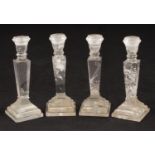 Four Neoclassical-Style Rock Crystal Candlesticks , 20th c., tapered standard, on stepped base ,