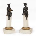Pair of Continental Patinated Bronze Allegorical Figures of America , male and female figures, on