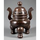 Large Chinese Patinated Bronze Covered Tripod Censer , pierced domed cover with ball finial, bombe