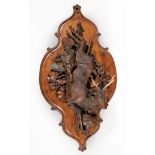 Large Swiss Black Forest Plaque , late 19th c., carved with game birds and deer, mounted with
